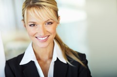 Cute young business woman smiling